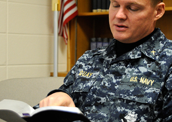 Picture of Navy Chaplain reading Bible