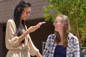 two female students in front of library