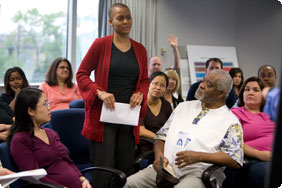 Woman in Red Sweater Standing Among People