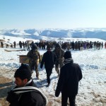 Advisers from the 738th Air Expeditionary Advisory Group assist in a drop of humanitarian supplies Jan. 27, 2012 at a remote village in Afghanistan.(courtesy photo)