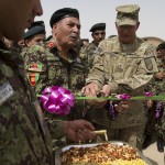 U.S. Army Brig. Gen. Clark LeMasters, right, the deputy commander of Support Operations, NATO Training Mission Afghanistan, and Afghan National Army Maj. Gen. Hotak, the commander of the ANA's Army Support Command, cut the ribbon to open the 215th Maiwand Corps' Forward Supply Depot at Camp Shorabak, Helmand province, Afghanistan, Sept. 5, 2012. The FSD will supply the Afghan National Army's 215th Maiwand Corps in Helmand and Nimrouz provinces. (Photo by Bill Putnam,Regional Support Command-Southwest, Public  Affairs Specialist)