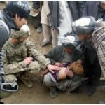 Pfc. Kyle Koblinski, medic assigned to Alpha Company, 1st Battalion, 125th Infantry Regiment, 37th Infantry Brigade Combat Team, examines a 4-year-old girl March 23, 2012, as others look on. The father brought the girl to the Soldiers because she was not feeling well. The 37th IBCT is deployed to northern Afghanistan in support of the International Security Assistance Force in order to build Afghan National Police capacity. (37th IBCT photo by Spc. James Simpson)