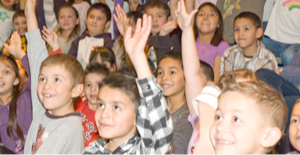 children raising hands