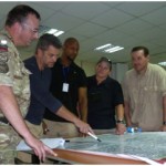 : Stability operations professionals gathered at the Counterinsurgency Training Center, Camp Julien, Kabul from 18-20 June 2001 to study  the District Stability Framework. Pictured are civilians and NATO students working through the demanding ‘Design’ phase, where they are challenged to idnetify and target route causes of instability in Afghanistan.