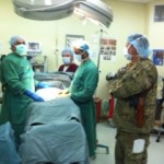 Cmdr. Richard Biggs, MC, USN Validation Team discusses surgical approach and technique with Dr. Al Kozai, Chief of Surgery, Herat Regional Military Hospital Camp Stone.