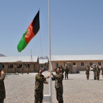 Afghan National Army (ANA) soldiers hoist the Afghan national flag symbolizing the transition of Training Support Site Shouz from the Regional Support Command-West (RSC-W) to ANA partners Aug 15. Regional Support Command-West is part of the Deputy Command of Support Operations, NATO Training Mission – Afghanistan.