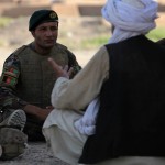 An Afghan National Army soldier speaks to a village elder during a recent patrol. The soldiers are learning the skills necessary to gather information from and build rapport with local citizens. The soldiers took the lead in communicating with area residents during the patrol, while Marines from Headquarters Battery, 1st Battalion, 12th Marine Regiment, provided support and guidance when necessary.