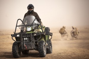 Afghan Border Police Pvt. Sayed Khan, a medic with 4th Tolai, 2nd Kandak, Helmand ABP, drives past U.S. Marines with Weapons Company, 3rd Battalion, 3rd Marine Regiment, on a security patrol during Operation Shahem Tofan (Eagle Storm). (Photo by Cpl. Reece Lodder)