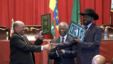 Sudan's President Omar al-Bashir, left, and South Sudan President Salva Kiir, right, shake hands on the completion of a signing ceremony after the two countries reached a deal on economic and security agreements in Ethiopia, Sept. 27, 2012. (AP)