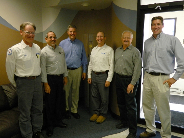 Under Secretary of Commerce for Standards and Technology Patrick Gallagher (center in blue shirt) pauses with his hosts and other NIST senior official after a tour of the company’s manufacturing facility in Leipsic, Ohio.  Left to right  Eric Franks, Manager of Technology & Quality, PRO-TEC, Harry Hertz, Director, NIST Baldrige Performance Excellence Program; Bryan Vaughn, President, PRO-TEC; Roger Kilmer, Director, NIST Manufacturing Extension Partnership;  and Kevin Kimball, NIST Chief of Staff. 