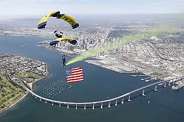 Members of the U.S. Navy parachute demonstration team, the Leap Frogs, perform a T-formation during a training jump above Naval Amphibious Base Coronado. The team is stationed in Coronado and performs demonstrations across the country in support of Naval Special Warfare and Navy recruiting.  U.S. Navy photo by James Woods (Released)  110316-N-0000W-254