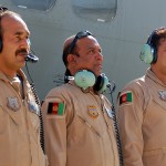 Afghan air force Capt. Shahnawaz Nabi Zada, C-27A loadmaster, Maj. Nik Mohamad, C-27A co-pilot, and Col. Aimal Pacha, C-27A aircraft and squadron commander, each assigned to the AAF Kabul Air Wing, stand for a moment on the Kabul, Afghanistan, International Airport flightline ahead of their first independent flying mission together without the onboard presence of coalition mentors. The crew flew a one-hour proficiency training mission July 19, 2012, the first C-27A independent flying mission for the Afghan AF. (Afghan air force photo by Capt. Rahmi Khoda Rahimi)