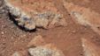 This image provided by NASA shows shows a Martian rock outcrop near the landing site of the rover Curiosity thought to be the site of an ancient streambed. Curiosity landed in a crater near Mars' equator on Aug. 5, 2012, on a two-year mission to study whe