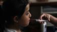 A nurse uses a syringe to give liquid medicine to a girl at San Jose Hospice in Sacatepequez, about 45 km (27 miles) of Guatemala City, November 30, 2011. (Reuters)