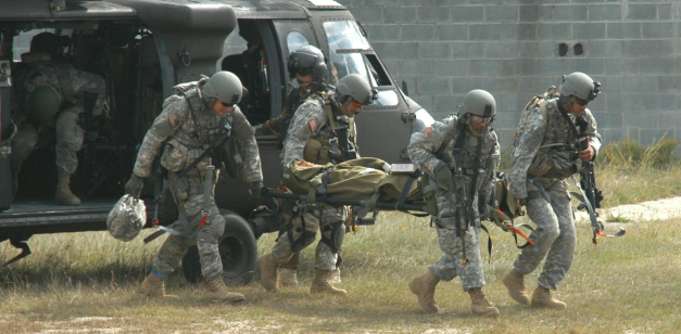 Soldiers unload a simulated casualty from a UH-60 Blackhawk