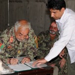 Brig. Gen. Abdul Basir, the commander Afghan National Army's Logistics Command, signs transition paperwork assuming responsibilities for the Chimtallah National Ammunition Depot Sept. 16, in Kabul, Afghanistan. The transition ceremony took place in one of the new bunkers at the depot. The depot stores anything from small arms ammunition to rocket propelled grenades, in the current value of $ 160 million. (U.S. Army photo by Capt. Monika Comeaux, DCOM-SPO/NTM-A PAO)