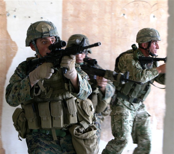 VAZIANI TRAINING AREA, Republic of Georgia-Sgt. Nicholas Maugeri, squad leader with Company A, Anti-Terrorism Battalion, teams up with Georgian soldiers to conduct Military Operations in an Urban Terrain training here July 19 during Exercise Agile Spirit 2011. Agile Spirit is designed to increase interoperability between the forces by exchanging and enhancing each otherrâ?s capacity in counterinsurgency and peacekeeping operations, including: small unit tactics, convoy operations, and counter-Improvised Explosive Device training.
(Cpl. Nana Dannsaappiah)