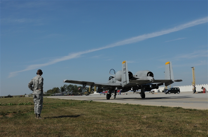 NAMEST AIR BASE, Czech Republic -- An Airman from the 81st Fighter Squadron looks on as an A-10 Thunderbolt II taxis down the runway before taking off for a close air support and forward air control training mission Sept. 10, during Ramstein Rover 2012 here. RARO 12 is a NATO partnership building exercise involving more than 16 nations. A-10 Thunderbolt IIs from the 81st FS are participating in the exercise to provide close air support to partnering nations and practice forward air control missions with their NATO allies in international security assistance force realistic scenarios. During this mission the 81st FS pilots supported German and Italian forward air controllers. Participating in exercises like RARO 12 ensures effective employment of airpower in support of alliance or coalition forces while mitigating risks to civilians in contingency operations. 