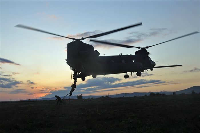 Romanian and Norwegian special operations forces conduct fast rope familiarization training on a vessel in the Black Sea with Sailors from U.S. Navy Special Warfare Unit 2 on a Chinook helicopter from the U.S. Army’s 160th Special Operations Aviation Regiment off the shores of Romania Sept. 14, 2011. Jackal Stone is an annual multinational special operations exercise designed to promote cooperation and interoperability between participating forces, build functional capacity and enhance readiness. This year nine nations are participating in various locations in Bulgaria, Romania and Ukraine.