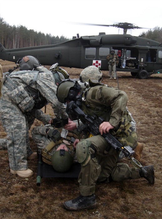 Members of the 1st Battalion, 10th Special Forces Group (Airborne) conduct casualty evacuation training alongside a team of Polish soldiers from the 1st Special Forces Regiment of the Poland Special Operations Command on March 14 at the Joint Multinational Training Center at Grafenwoehr, Germany as part of honing their skills and their ability to operate seamlessly together. Training opportunities, identified as a result of annual Operations, Activities and Actions Conferences, allow U.S. Embassy country team members and SOF force providers to focus on future engagements.