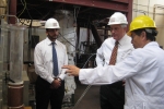 Ohio State University (OSU) Professor Liang-Shih Fan shows Assistant Secretary for Fossil Energy Charles McConnell OSU's coal direct chemical looping reactor. | Photo by Niranjani Deshpande