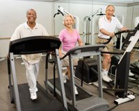 Photo: Three senior adults on treadmills