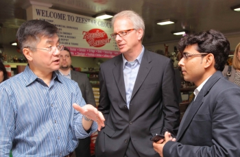 Locke, Alex Lintner and store owner, Deepak Gupta