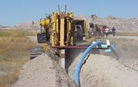 Burying pipeline on the Pine Ridge Reservation.