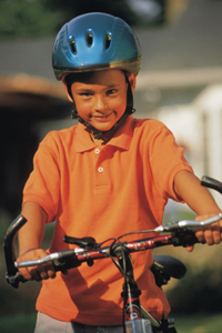 boy on a bicycle wearing a helmet
