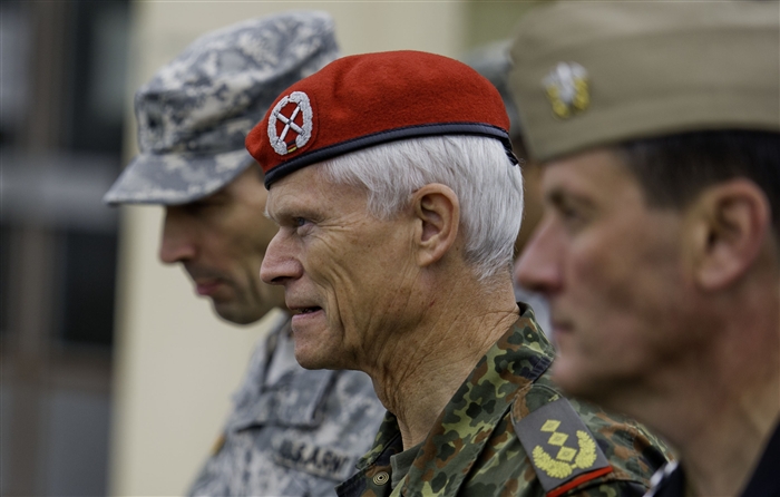 GRAFENWOEHR, Germany - German Army Lt. Gen. Reinhard Kammgrer, Commander, German Army forces command, walks to the next briefing area during Combined Endeavor (CE) 2012 Distinguished Visitors Day, Joint Multinational Training Command, Grafenwoehr, Germany, Sept. 13, 2012. CE12 is a multinational command, control, communications and computer systems exercise designed to build and enhance communications and network interoperability between 41 nations and international organizations.