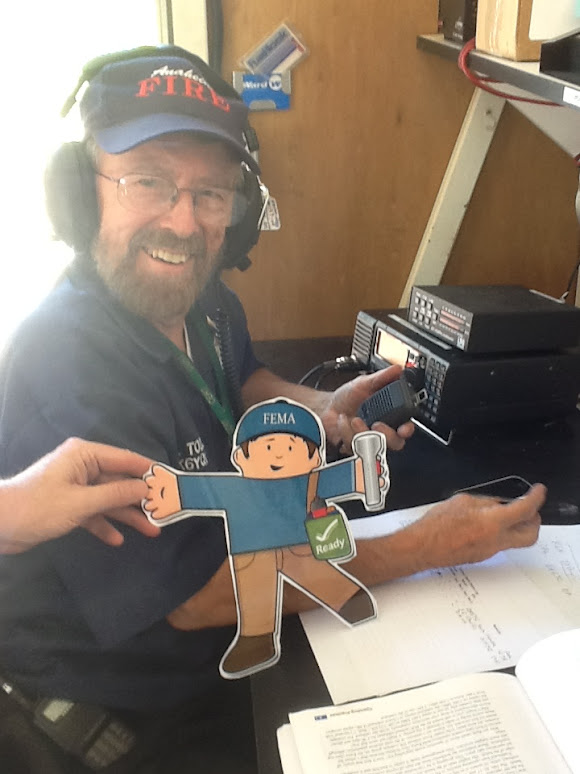 Flat Stanley poses with RACES volunteer.