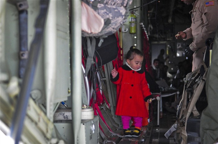 DJERBA ZARIS, TUNISIA (March 11, 2011) -- An Egyptian girl explores the interior of the U.S. Air Force C-130J that will fly her and her family from Djerba Zarzis Airport in Tunisia to Cairo, Egypt. These Egyptian citizens are among tens of thousands who have fled conflict in Libya to Tunisia, where a humanitarian crisis is unfolding. This C-130J, flown by the 37th Airlift Squadron from Ramstein Air Base, Germany, is part of a contingent of aircraft from the 37th and the 26th U.S. Marine Expeditionary Unit that are transporting the evacuees home. Since the operations began March 4th, more than 750 passengers have been shuttled to Cairo.  The airlift is part of a broader U.S. government effort led by the Department of State to assist with the crisis. (U.S. Army Photo by Staff Sgt. Brendan Stephens/RELEASED)