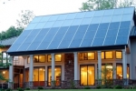 This North Carolina home gets most of its space heating from the passive solar design, but the solar thermal system supplies both domestic hot water and a secondary radiant floor heating system. | Photo courtesy of Jim Schmid Photography, NREL