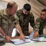 Afghan non-commissioned officers, at right, handle day-to-day instruction of soldiers. Coalition mentors such as Italian Colonel Nurri, observe the training -- adding professional insight when it would benefit the instructors and students. (Photo by G. A. Volb)