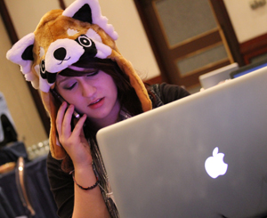 Journalism Student at Computer and on Phone