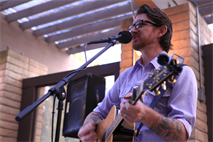 MARINE CORPS BASE CAMP PENDLETON, Calif. -- Rick Remender puts on a show for guest by performing iconic songs from various musical artists at Camp Pendleton's Officers' Pub 1795, Sept. 21. Remender provided entertainment for Marines aboard the base to show his support for military members and as a way to give back to the community.