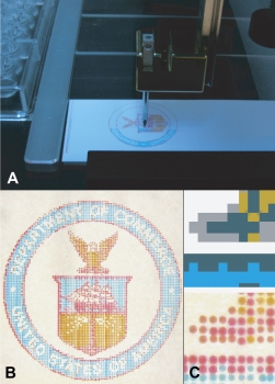 Microarrayer machines (A) now can mix colors and deposit them on microscope slides, which can be used to calibrate hyperspectral imagers (HSI) for use in medical applications. The finished slides can be custom-colored (B) to calibrate HSIs to find specific types of tumors or disease tissue. Close up, they resemble dot-matrix printwork (C). Photo: Clark/NIST