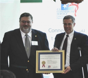 Tektite founder, Scott Mele, receiving the Export Achievement Award from the Department of Commerce. Scott Mele on left, Congressman Rush Holt on right.