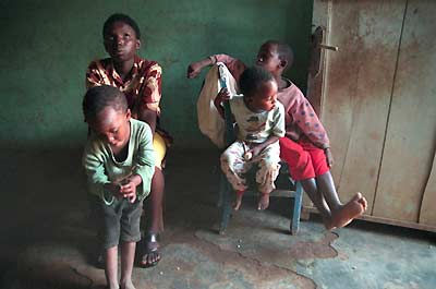 Adelphine with her brothers and neighbor children in a rare moment of leisure.