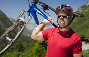 man outdoors with bike