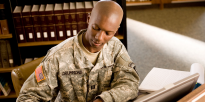Army JAG lawyer writing briefing notes