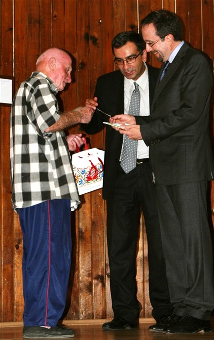 U.S. Ambassador to the Republic of Georgia John R. Bass (far right) receives an award on the behalf of Marine combat engineers July 27 for renovating a senior citizens home here. The Marines were in Georgia for Exercise Agile Spirit 2011, an exercise designed to increase interoperability between Georgian Armed Forces and Marines. The engineerssâ? job was to build relationships with the Eastern European nation by offering their skills to its people. (Photo by Cpl. Nana Dannsaappiah)