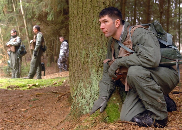 SPANGDAHLEM AIR BASE, Germany &mdash; Air Force Staff Sgt. Robert Martin, 52nd Operations Support Squadron, demonstrates proper evading procedures during Combat Survival Training, Jan. 26. The CST program is a fast paced two-day refresher course that provides pilots with the skills to return home. (Department of Defense photo by Air Force Airman Staci Miller) 