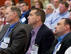 Photo of participants listening to a speaker at the Commercial Building Energy Alliances Executive Exchange with Commercial Building Stakeholders forum at the National Renewable Energy Laboratory (NREL) in Golden, Colorado, on May 24, 2012.