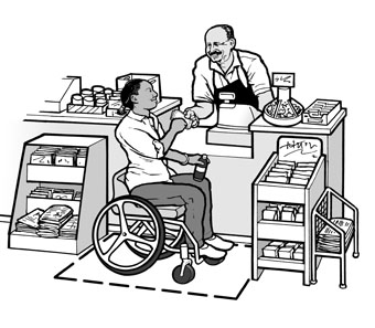 A woman using a wheelchair is buying a drink at a small grocery store.  Adequate maneuvering space and a low, uncluttered counter make it possible for her to approach the sales counter.