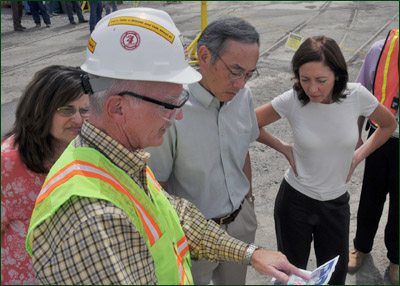 Washington Closure Hanford President Chuck Spencer, foreground, briefs Assistant Secretary for Environmental Management Ines Triay, left, Secretary of Energy Dr. Steven Chu, center, and U.S. Sen. Maria Cantwell, right, during the Secretary’s visit to Hanford’s N Reactor on Aug. 11, 2009.