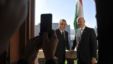 British Foreign Minister William Hague (L) and Hungarian Prime Minister Viktor Orban pose for photographers on a balcony during their meeting at Orban's office in the Parliament building in Budapest, Hungary, October 4, 2012.