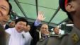 Burma's President Thein Sein (C) waves to supporters as he arrives at Rangoon International Airport from a trip to the U.S., in Rangoon, Burma, October 1, 2012.