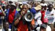  A mineworker addresses his colleagues before taking part in a march outside the Anglo American mine in South Africa's North West Province, September 12, 2012. 