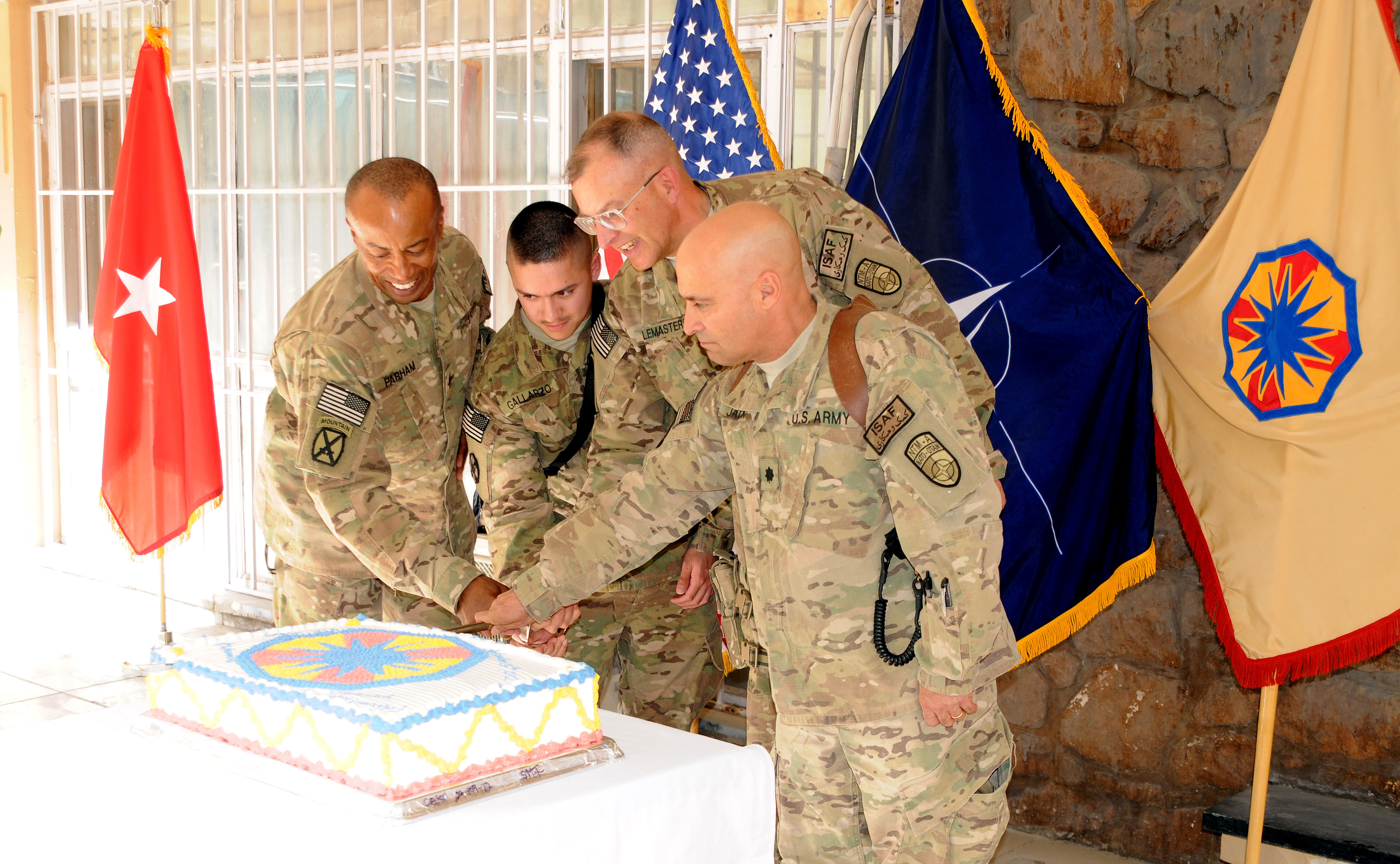 Command Sgt. Maj. Terry E. Parham, the senior noncommissioned officer of Deputy Command of Support Operations and the 13th Expeditionary Sustainment Command, Spc. Ariel Gallarzo, an ammunition handler and the youngest deployed Soldier of the 13th ESC, Brig. Gen. Clark W. LeMasters, DCOM-SPO and 13th ESC commander and Lt. Col. Ronald Jack, logistics operations chief and the oldest deployed member of the 13th ESC cut a cake to celebrate the 47th birthday of the 13th ESC at Camp Eggers, Afghanistan on Sept. 24. (U.S. Army photo by Capt. Monika Comeaux, DCOM-SPO/NTM-A PAO)